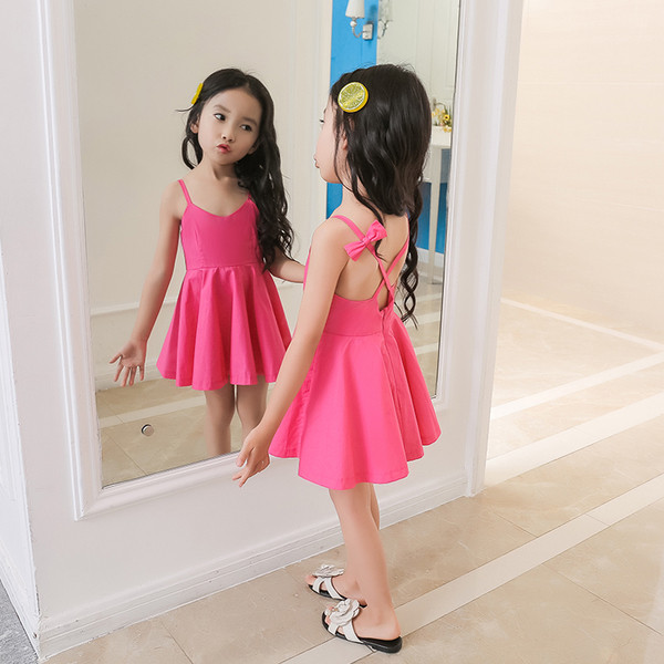 Rochie casual pentru copii cu bretele incrucisate si panglici in alb si roz