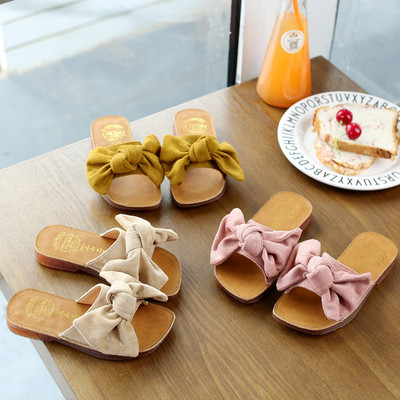 Children`s slippers with a ribbon for girls in three colors