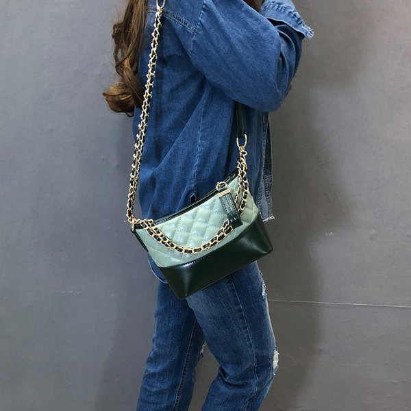 Geanta de dama cu maner lung si elemente metalice