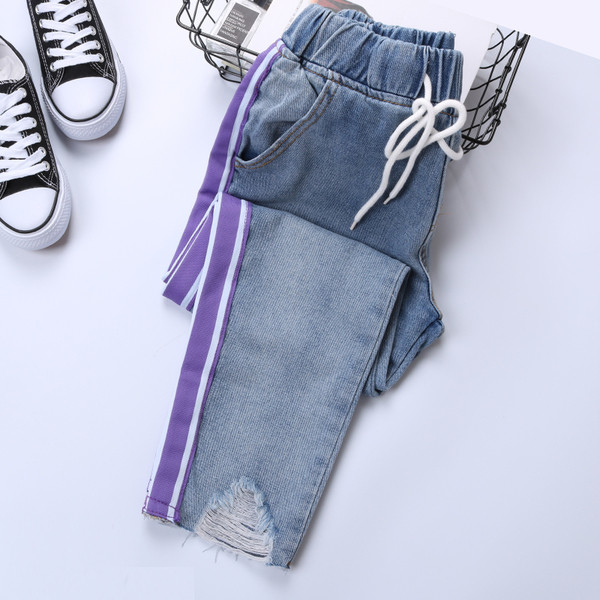 Дамски дънки с еластична талия и разкъсани мотиви в два модела