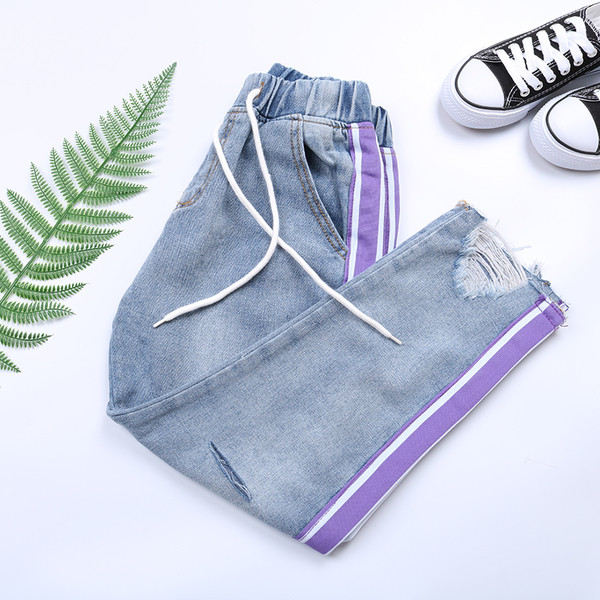 Дамски дънки с еластична талия и разкъсани мотиви в два модела