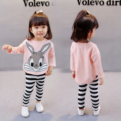 Children`s set for girls including a blouse with applique and striped leggings